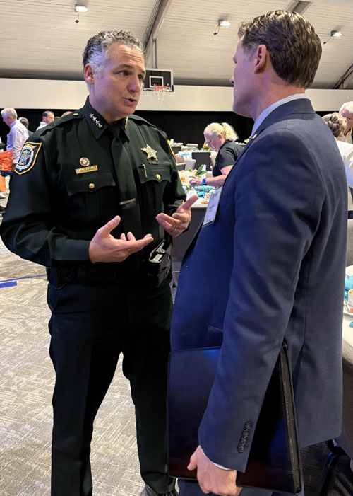 Ryan Elijah with a Central Florida sheriff&rsquo;s deputy