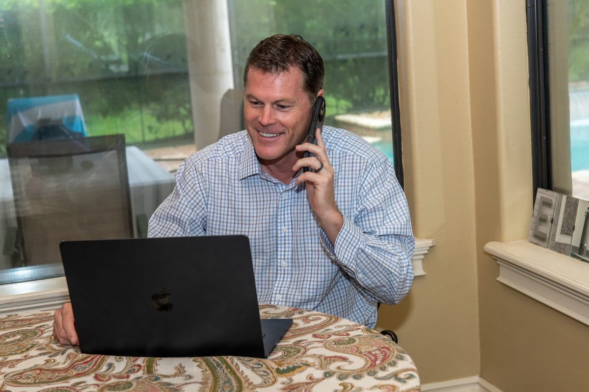 Ryan Elijah on the phone with a constituent